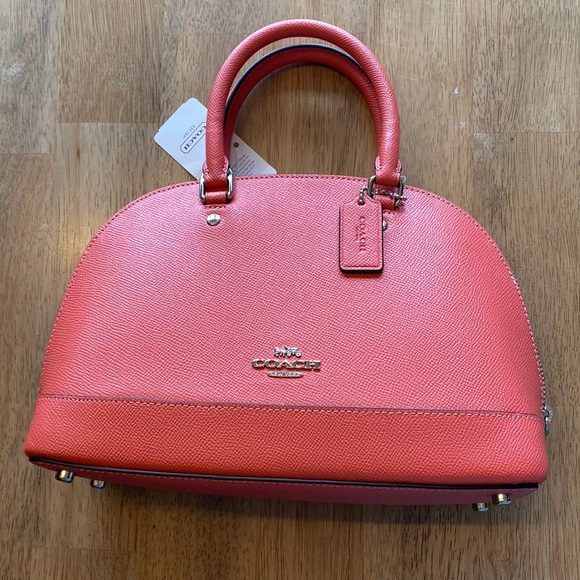 Brand new with tags coral coach mini bag